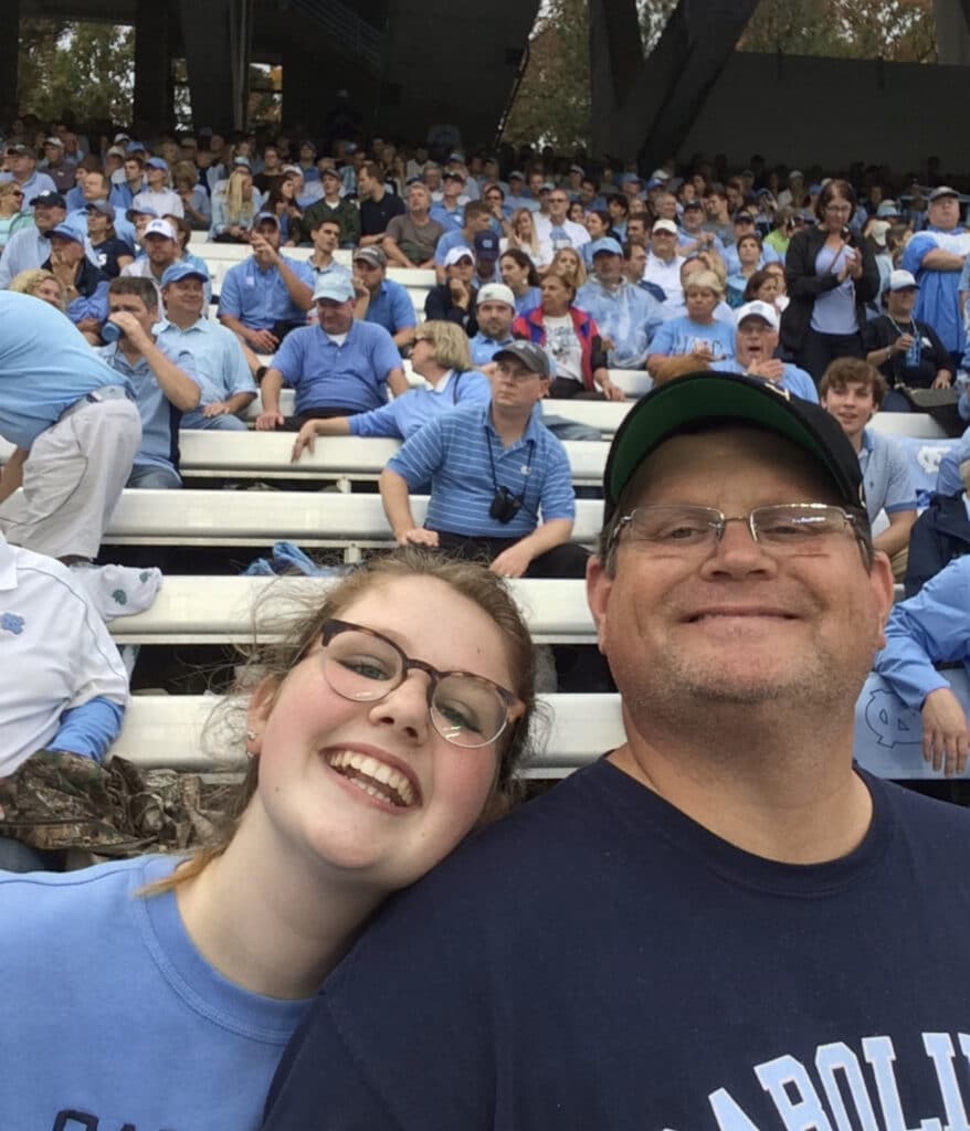 Dr Chuck and daughter at a UNC football game