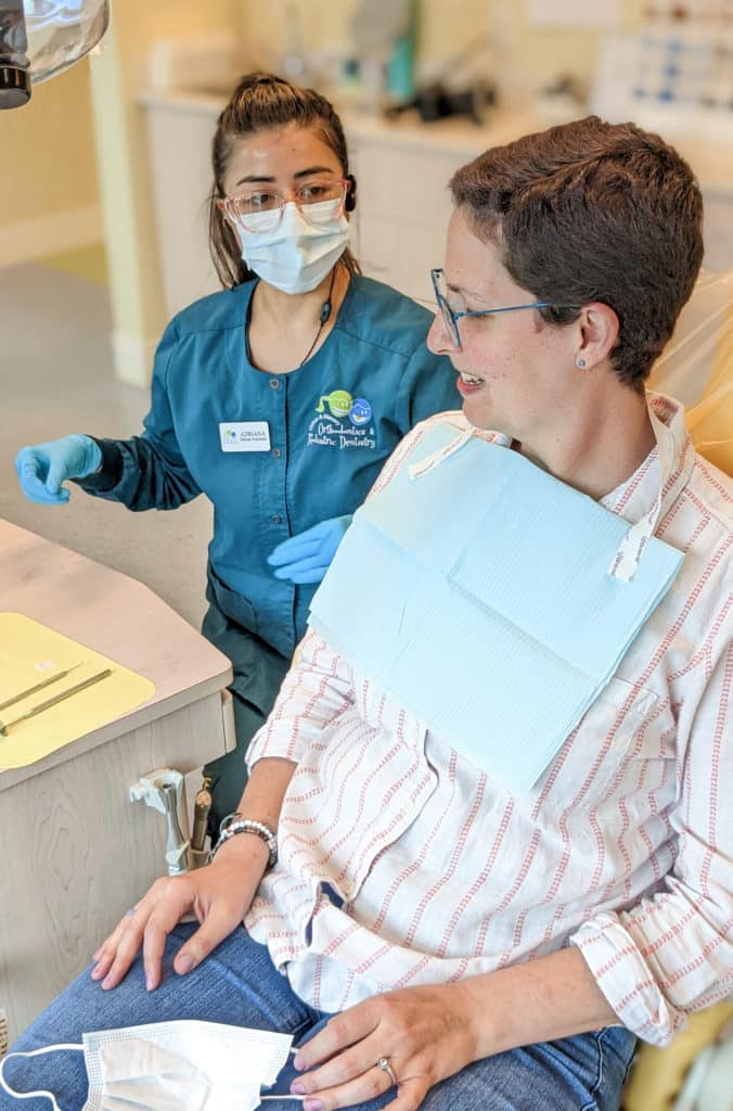 a clifton and mauney patient receiving orthodontic care by an orthodontic assistant