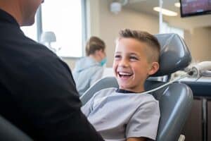 Boy smiling in dentist chair