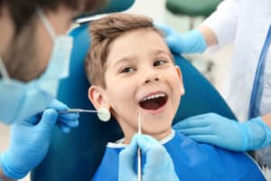 a child gets his teeth whitened at the pediatric dentist