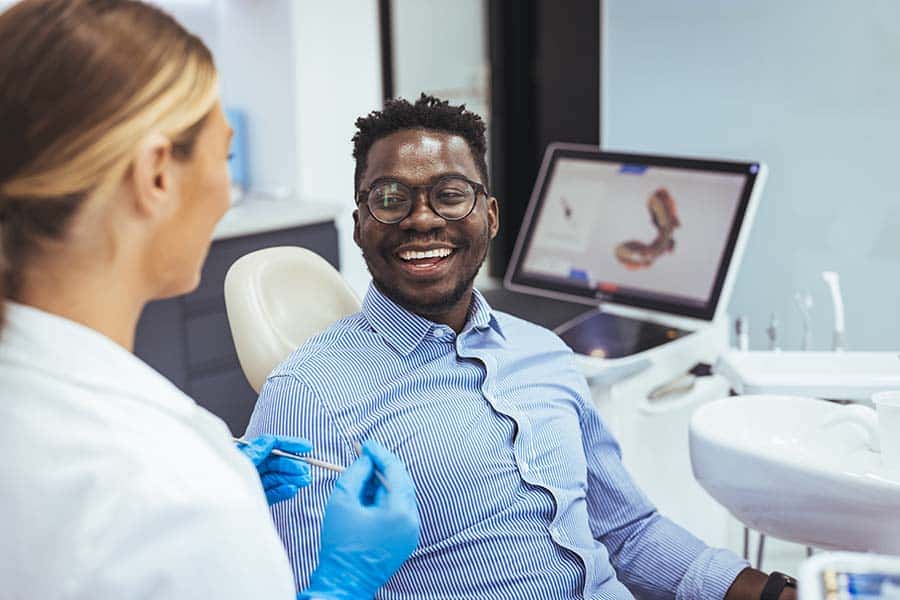 man smiling after his dental visit