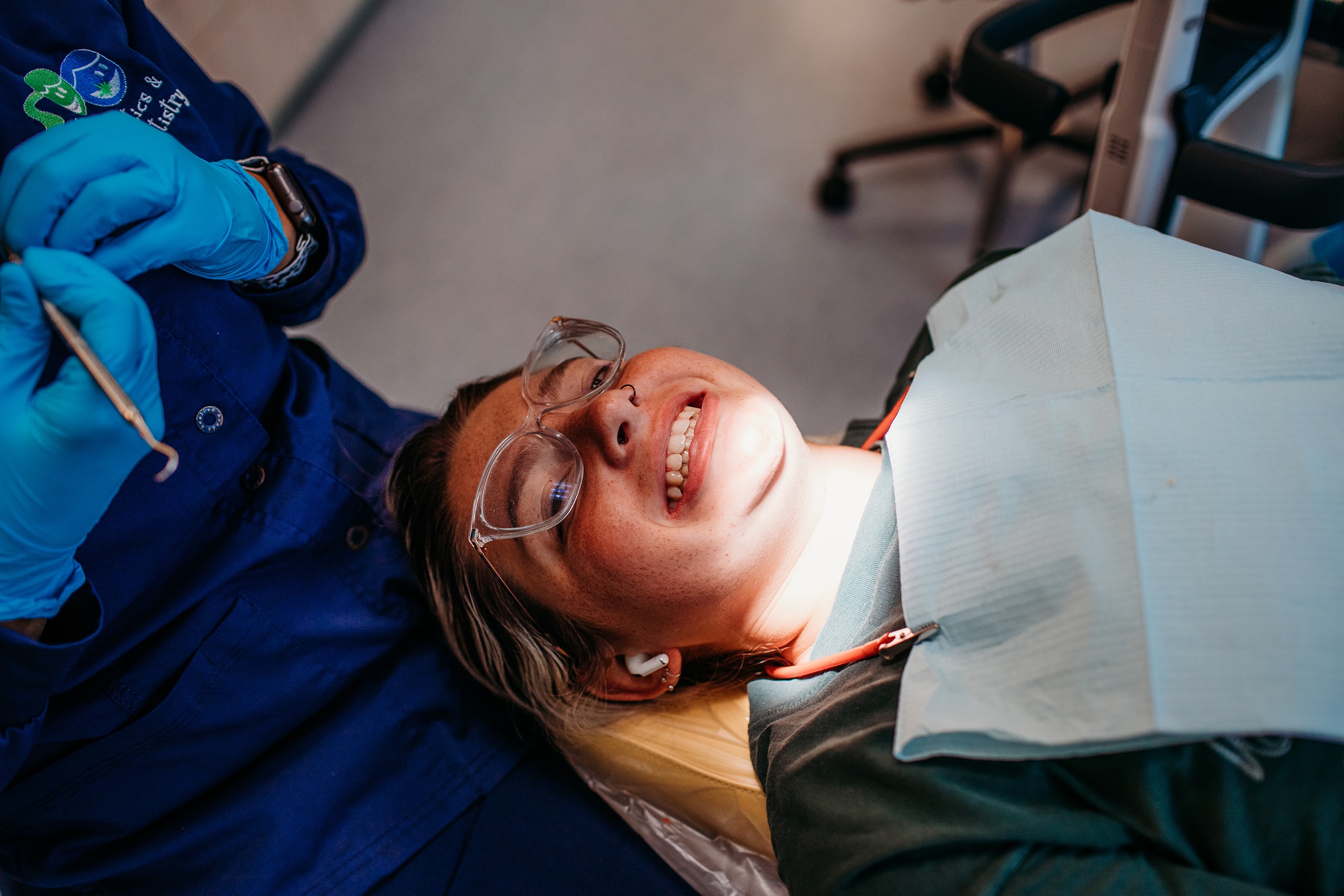 Teen patient smiling at the camera during her appointment at Clifton & Mauney