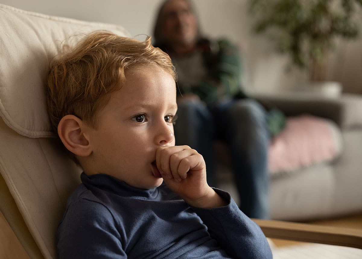 a young child sucks their thumb