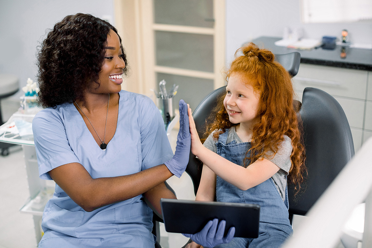 a pediatric dentist meets with a new client