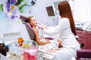 a chapel hill orthodontist works with a young patient
