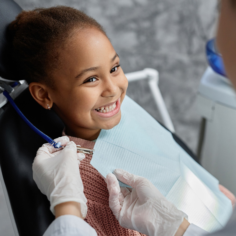 Girl happy in dentist's chair