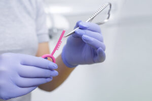 Dentist prepping elastomeric ties