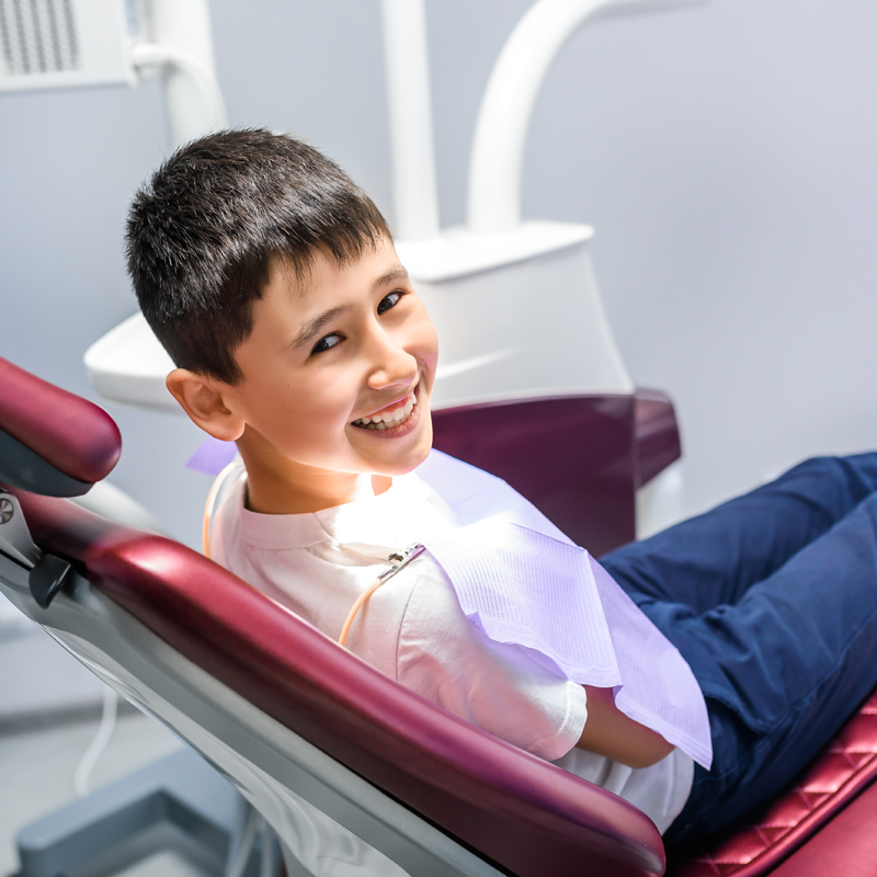Boy smiling in dental chair
