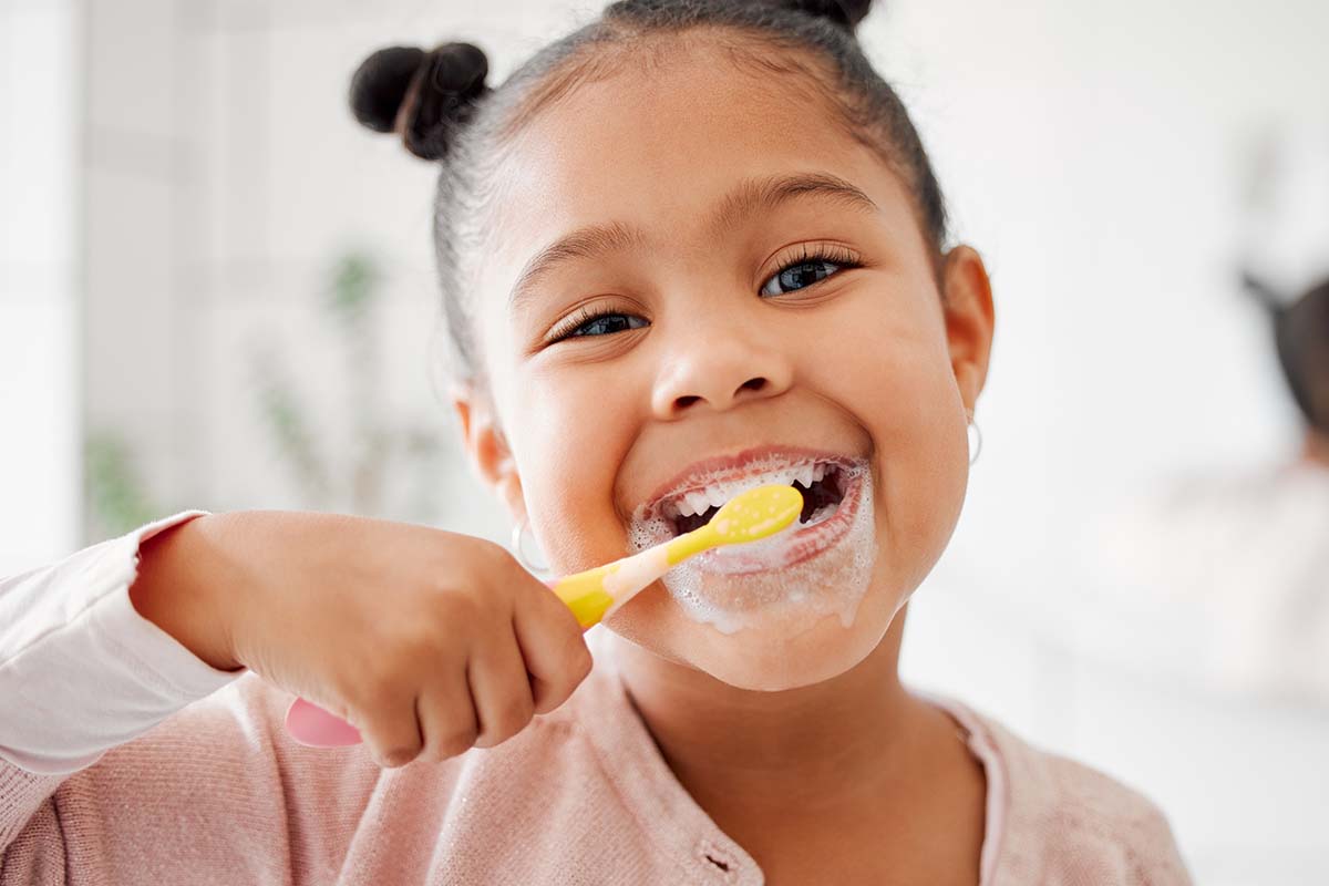 child brushing teeth